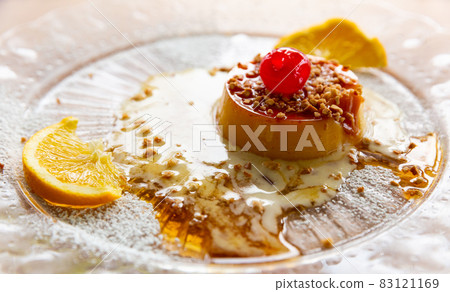 Tocino de cielo with caramel sauce, nuts and orange Tocino de cielo with caramel sauce, nuts and orange 83121169