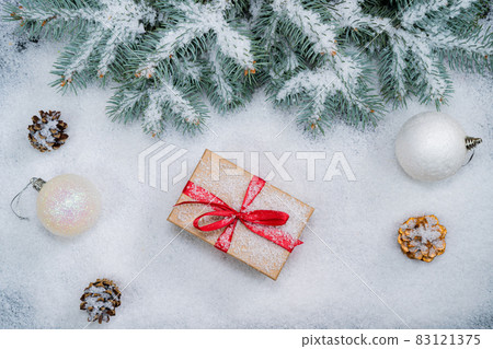 Christmas background with gift boxes in snow 83121375
