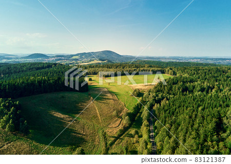 Mountains and green fields, aerial view. Panorama of beautiful landscape Mountains and green fields, aerial view. Panorama of beautiful landscape 83121387
