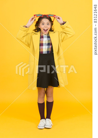 Perfect for school party. Happy party girl yellow backgroundrating Perfect for school party. Happy party girl yellow backgroundrating 83121648