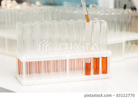 Test-tubes with yellow liquid in the laboratory Test-tubes with yellow liquid in the laboratory 83122770