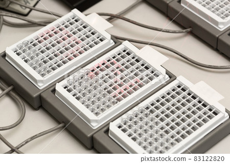 A chemical sample bottle. Centrifuge. A test tube vial sets for analysis. A chemical sample bottle. Centrifuge. A test tube vial sets for analysis. 83122820
