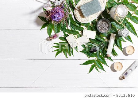 Composition of spa treatment on white wooden table with space for text. Top view 83123610
