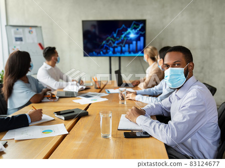 New Normal. Diverse Business People In Face Masks Having Conference In Office 83124677
