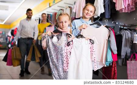 Sisters with parents in store Sisters with parents in store 83124680