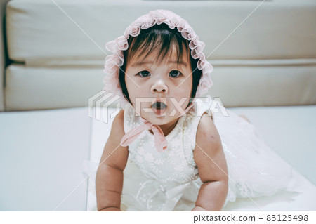 Portrait of Little baby girl wear white hood. Portrait of Little baby girl wear white hood. 83125498