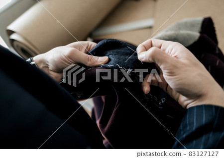 Tailor hands working in tailor shop Tailor hands working in tailor shop 83127127