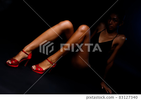 Long Slim Legs with nice skin finger and shape of 20s asian tanned skin woman. Female model 83127340