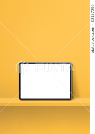 Digital tablet pc on yellow wall shelf. Vertical background banner 83127396