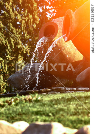 Kvareli, Georgia. Fountains in the form of wine pitcher. Sun flare Kvareli, Georgia. Fountains in the form of wine pitcher. Sun flare 83129097
