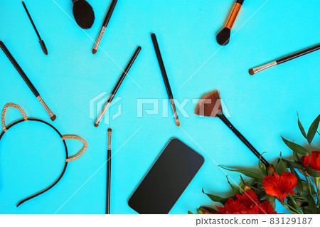 Various brushes on blue background Various brushes on blue background 83129187