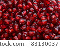 Full frame macro shot background of pomegranate peeled ripe seeds 83130037