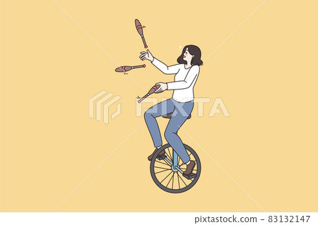 Woman ride unicycle juggle with skittles  83132147