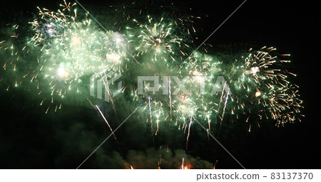 Green Firework celebrate anniversary happy new year 2022, 4th of july holiday festival. Green firework in night time celebrate national holiday. Countdown to new year 2022 festival party time event Green Firework celebrate anniversary happy new year 2022, 4th of july holiday festival. Green firework in night time celebrate national holiday. Countdown to new year 2022 festival party time event 83137370