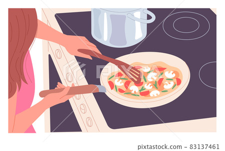A woman at the stove stirring food in a pan 83137461