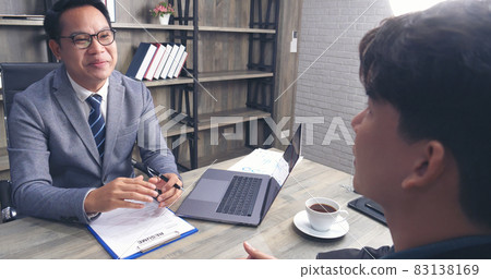 Job HR applicants having an interview with Human resource manager jobs interviewing with confident candidate at business firm office give cv resume. Job Interview with headhunter agent and applicant Job HR applicants having an interview with Human resource manager jobs interviewing with confident candidate at business firm office give cv resume. Job Interview with headhunter agent and applicant 83138169