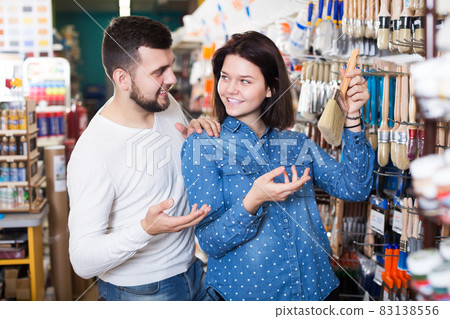 Couple choosing brush for house decoration 83138556