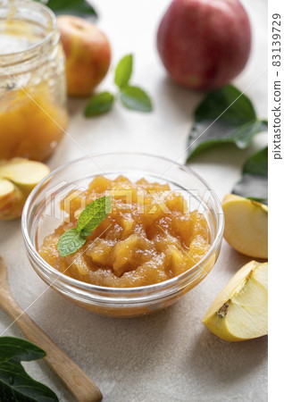 Homemade delicious fruit jam in glass bowl, made from red fresh apples. Homemade delicious fruit jam in glass bowl, made from red fresh apples. 83139729