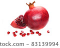 Ripe pomegranate whole fruit with slice and seeds isolated on a white background in close-up 83139994