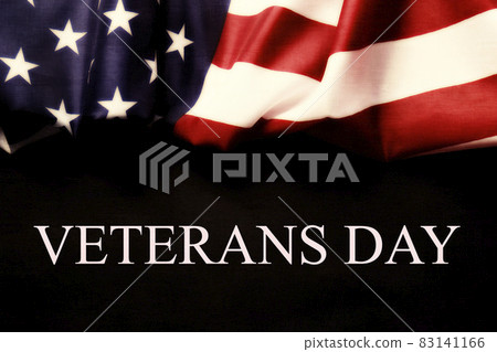 Veterans day remembrance concept. USA flag background. United States of America celebrates armed forces on november 11th. Close up, copy space, top view. 83141166