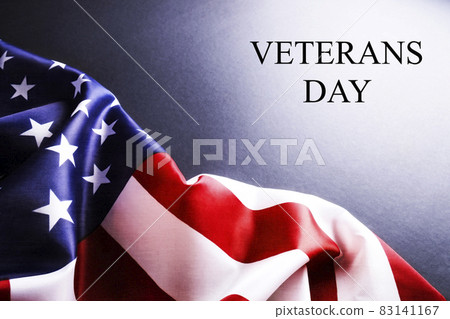 Veterans day remembrance concept. USA flag background. United States of America celebrates armed forces on november 11th. Close up, copy space, top view. 83141167