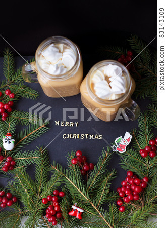 marshmellou hot cocoa trees in the background. The inscription Merry Christmas marshmellou hot cocoa trees in the background. The inscription Merry Christmas 83143109