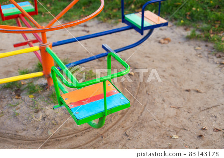 A bright playground, many different children's swings, a beautiful and cozy park for recreation. A bright playground, many different children's swings, a beautiful and cozy park for recreation. 83143178