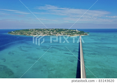 Aerial view of the blue sea of the main island of Okinawa with a drone (Kouri Island Kouri Ohashi) 83143620