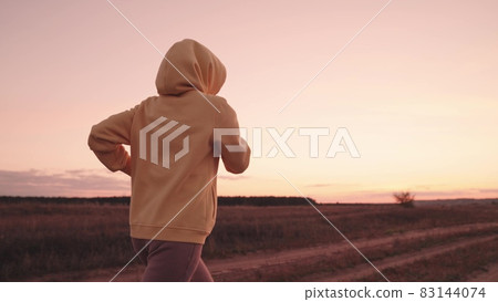 jogging at sunset, girl runs at dawn, healthy lifestyle, cardio for the heart, life in motion, sports person monitors health and body, actively engage in outdoor nature, physical energy training jogging at sunset, girl runs at dawn, healthy lifestyle, cardio for the heart, life in motion, sports person monitors health and body, actively engage in outdoor nature, physical energy training 83144074