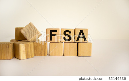 FSA symbol. Concept word 'FSA - flexible spending account' on cubes on a beautiful white background. Business and FSA - flexible spending account concept. Copy space. FSA symbol. Concept word 'FSA - flexible spending account' on cubes on a beautiful white background. Business and FSA - flexible spending account concept. Copy space. 83144886