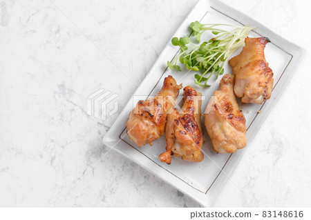 Grilled chicken wings with miso Grilled chicken wings with miso 83148616
