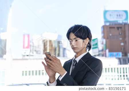 Businessman operating a smartphone Shibuya Businessman operating a smartphone Shibuya 83150171