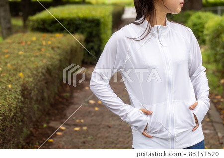 Women exercising in the park Women standing in sportswear 83151520