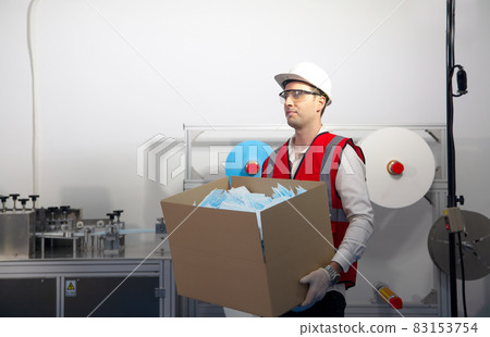 Quality control worker analyzing manufacturing machine in laboratory. Quality control worker analyzing manufacturing machine in laboratory. 83153754