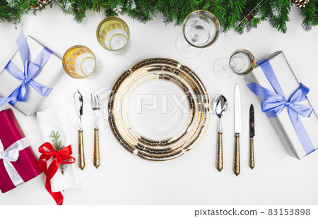 Close up beautiful Christmas table setting with decorations 83153898