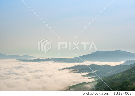 Surreal landscape of morning foggy..Morning clouds at sunrise.Landscape of fog and mountains of northern Thailand. Surreal landscape of morning foggy..Morning clouds at sunrise.Landscape of fog and mountains of northern Thailand. 83154005