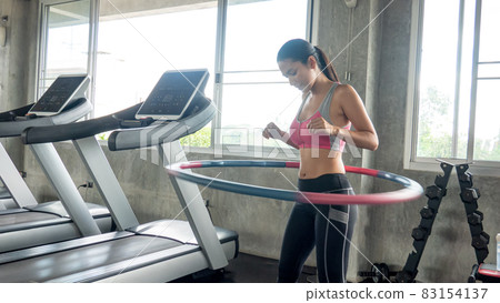 FITNESS AND WORKING OUT concept. Active lifestyle of Young people exercise and workout at fitness gym. 83154137