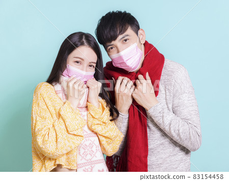 Young couple wearin  medical mask.Isolated  83154458