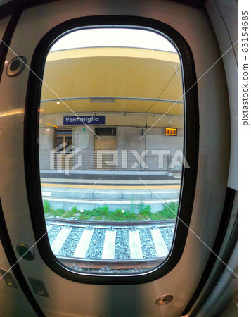 View of a railway station visible from a train in Ventimiglia, Italy 83154685
