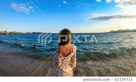 Woman on the beach in Cannes, France Woman on the beach in Cannes, France 83154715