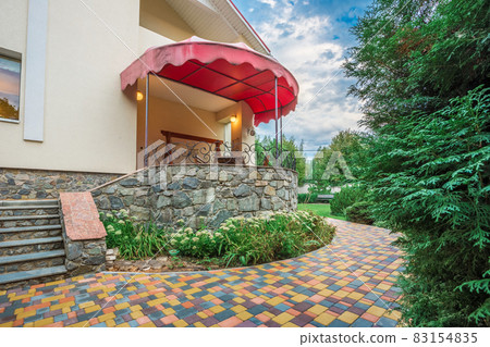 Horizontal view of single-family home with patio 83154835