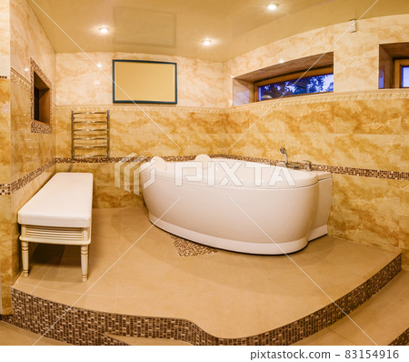 interior modern house, bathroom with marble tiles and jacuzzi interior modern house, bathroom with marble tiles and jacuzzi 83154916