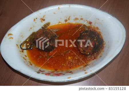 Top view of meat balls or meat kofta curry in masala gravy in a ceramic plate 83155128