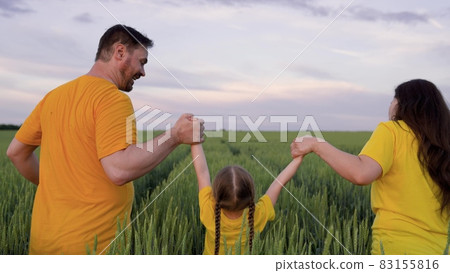 Happy family run through green field with wheat, childhood dream, wheat plantation for production of healthy food bread products, agricultural business, agriculture, mother father and little kid Happy family run through green field with wheat, childhood dream, wheat plantation for production of healthy food bread products, agricultural business, agriculture, mother father and little kid 83155816