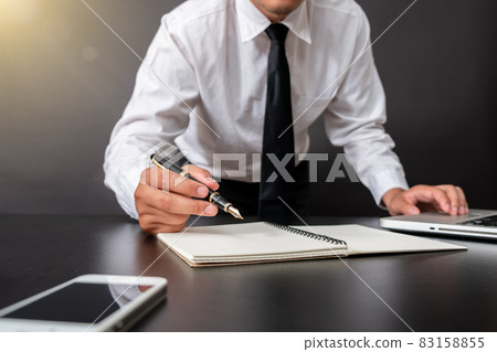Business and banking concept close up business man signing contract Business and banking concept close up business man signing contract 83158855