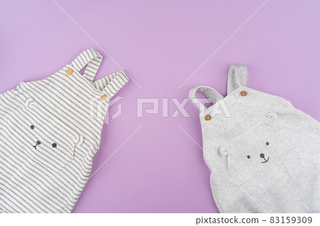 Baby girl clothes on lilac pastel background 83159309