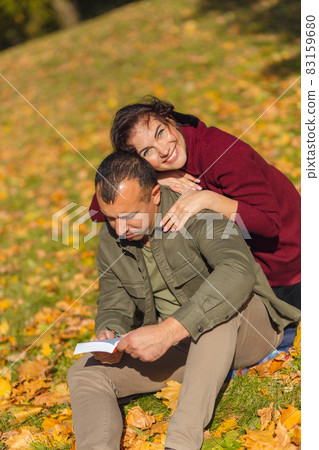 Lovely couple having fun together in nature. Lovely couple having fun together in nature. 83159680