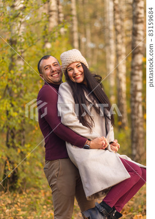 Lovely couple having fun together in nature. Lovely couple having fun together in nature. 83159684