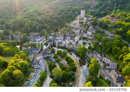 Aerial view of French village of Belcastel with castle in summer Aerial view of French village of Belcastel with castle in summer 83159706