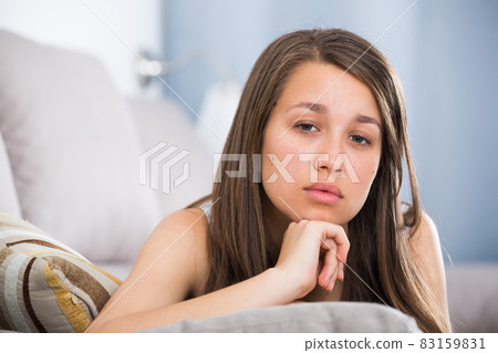 Young female is feeling sad and lonely Young female is feeling sad and lonely 83159831